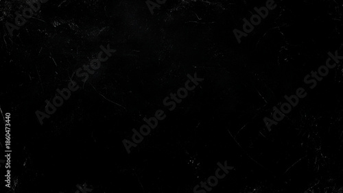 An entirely black image with a grainy texture suggesting darkness absence of light and minimal visual detail