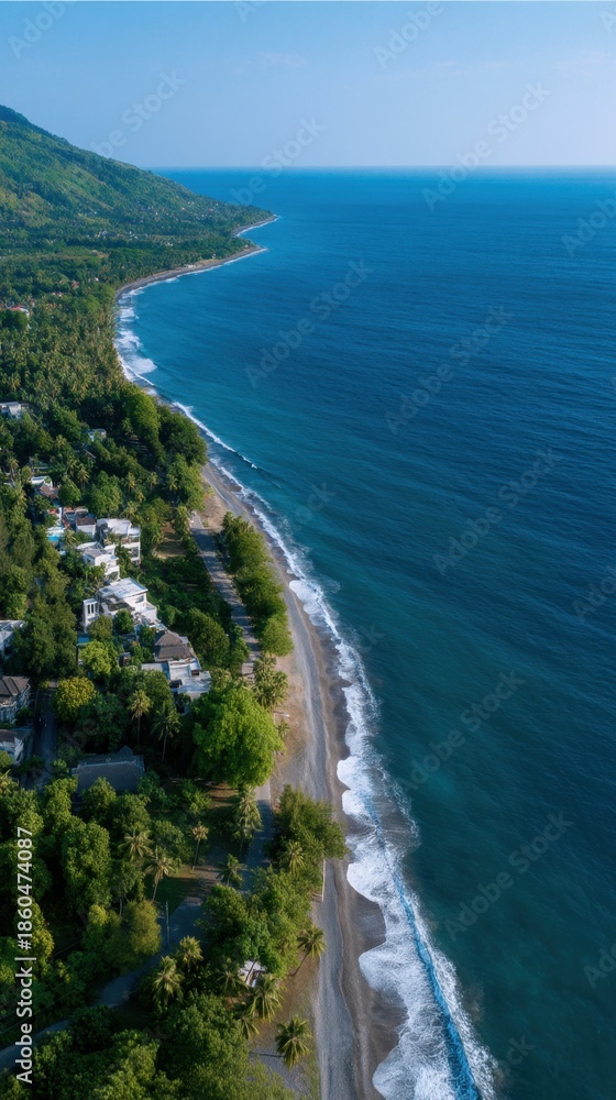 Obraz premium Aerial View of Pristine Coastline Featuring Resort Buildings and Lush Greenery