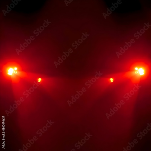 shows intense red lights glowing in a dark environment, creating a dramatic and mysterious atmosphere. The symmetrical light sources resemble stage lights or vehicle headlights, evoking tension, power