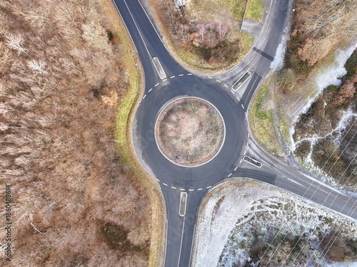 Aerial Drone View of a Circular Roundabout with Traffic in Winter Landscape