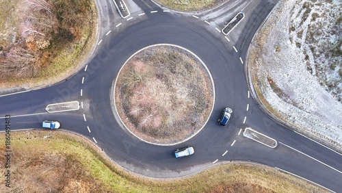 Aerial Drone View of a Circular Roundabout with Traffic in Winter Landscape