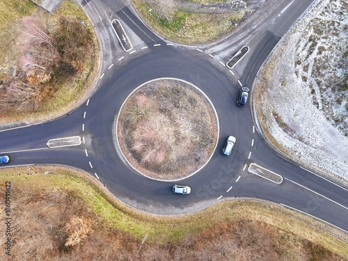 Aerial Drone View of a Circular Roundabout with Traffic in Winter Landscape