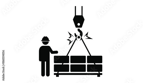 Construction worker overseeing a crane lifting heavy blocks or materials