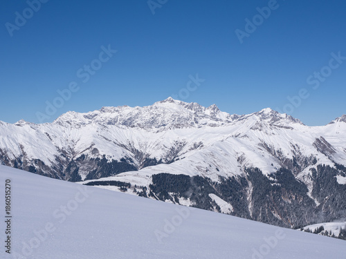 Praettigau, Switzerland - February 15th 2025: Amazing panorama of an alpine winter landscape
