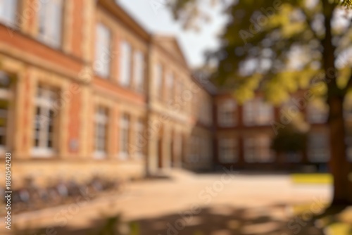 Wallpaper Mural Red Brick School Building with Green Lawn and Blue Sky. Defocused Image for Background. Torontodigital.ca