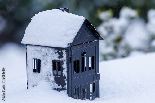 Small house lantern covered with snow in winter