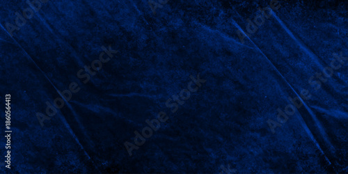 Dark blue grunge wall texture. dark navy-blue abstract texture resembling cracked stone or deep ocean rock. abstract dark blue background backdrop studio, cement concrete wall texture.
