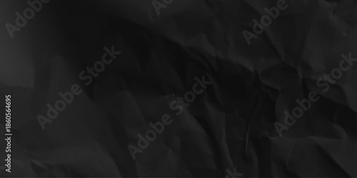 Crumpled black paper background texture