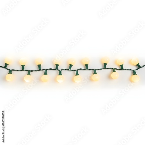 string of warm white globe lights on green wire with white background studio shot festive decoration illuminated round bulbs