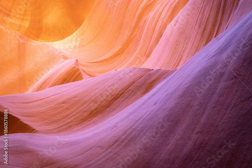 Stunning Sandstone Formations of Antelope Canyon with Vibrant Orange and Purple Tones
