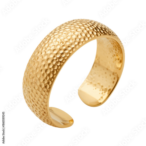 Golden Cuff Bracelet With a Textured Surface Displayed on a Plain Background
