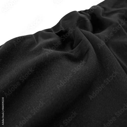 Black Fabric Draped on a Flat Surface Showing Texture and Folds During Daytime