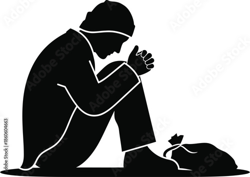 A solitary figure kneeling with a small dog a stark black silhouette