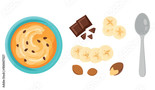 Nutritious breakfast bowl with peanut butter, banana slices, chocolate, almonds, and spoon