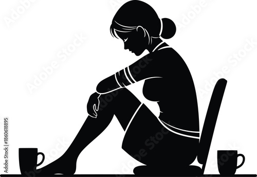 A woman sits alone with two cups of coffee in a contemplative mood