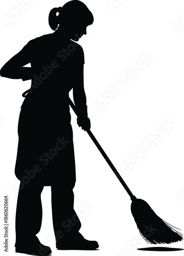 A silhouette of a woman sweeping the floor with a broom