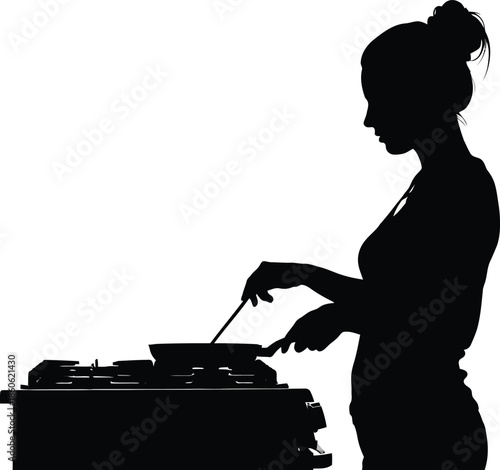 A woman cooks on a stove in a kitchen with a frying pan