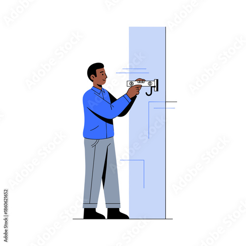 African adult male installing security camera on wall in blue shirt