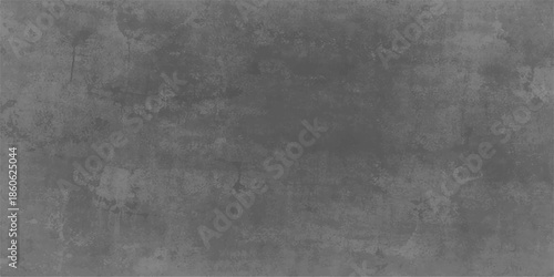 A dark and vintage grunge concrete wall features a rough grey stone texture and dirty black surface, creating a blank textured backdrop for old paper or industrial pattern wallpaper design
