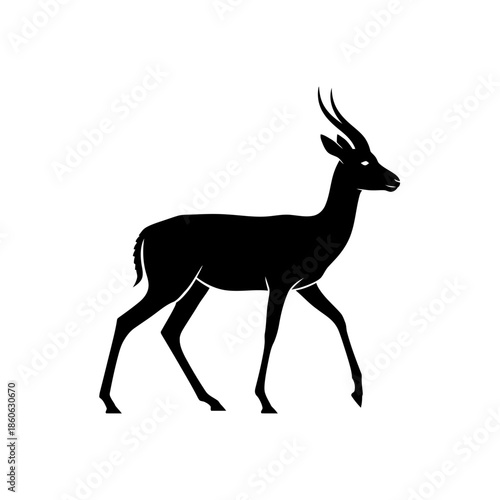 Black silhouette of an antelope walking.