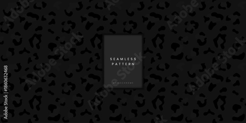 Wild seamless animal pattern featuring dark grey leopard or jaguar spots and panther print on black background for exotic fashion textile and luxury lifestyle branding