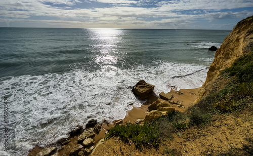 View of the sea and rocks of the beach of Olhos de Agua, Albufeira, Algarve, Portugal.