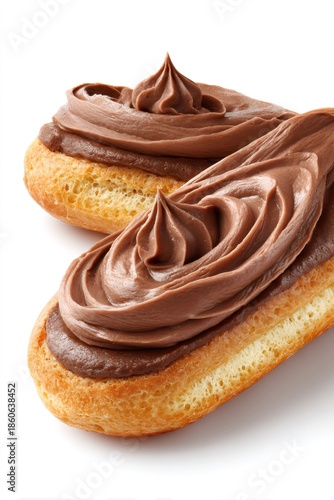 Two chocolate eclairs displaying golden choux dough with rich dark chocolate cream swirls, a sweet french pastry