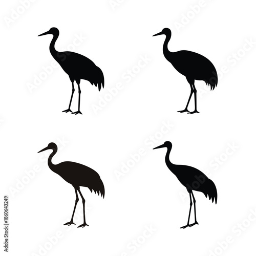 Elegant silhouettes of four standing cranes in a clean minimal design on white background