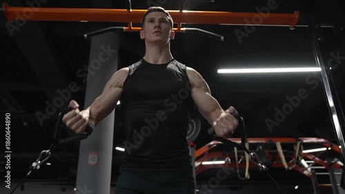 Lifting heavy cargo. Strength training in gym. Fitness weightlifting and bodybuilding exercise, lifestyle. Sport equipment machine. Man workout with resistance band in gym