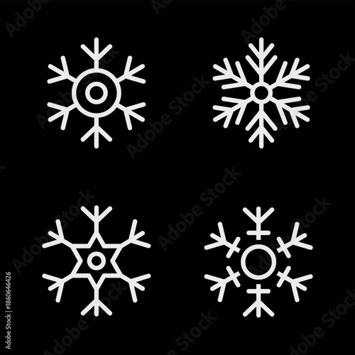 Four white snowflake icons on black background. Winter vector illustrations for Christmas and festive seasonal projects