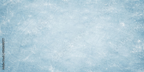 A bright blue grunge background features a frozen winter texture of ice and snow patterns on a cold frost surface resembling marble clouds and a vintage paper wall