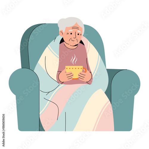 Elderly woman sitting in a chair holding warm tea under a blanket  