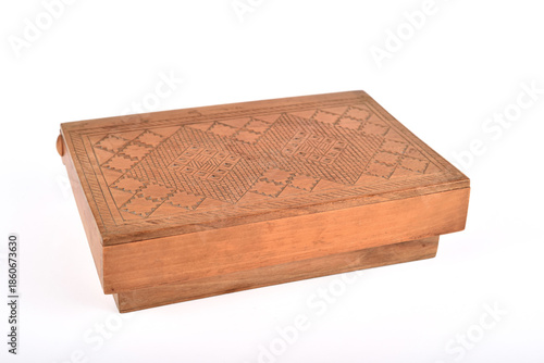 Handcrafted vintage carved wooden box isolated on the white background. Selective focus. 