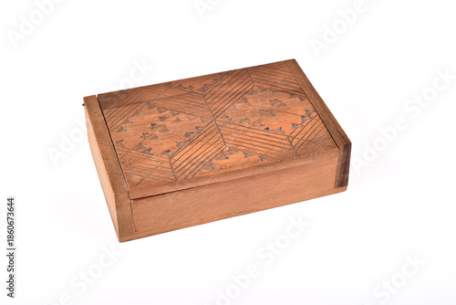 Handcrafted vintage carved wooden small box isolated on the white background. Selective focus. 