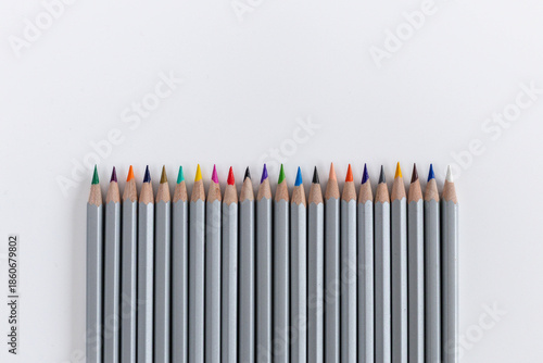 Pencils laid out in a row on a white background