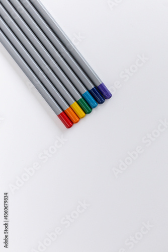 colored pencils on a white background