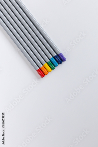 colored pencils on a white background