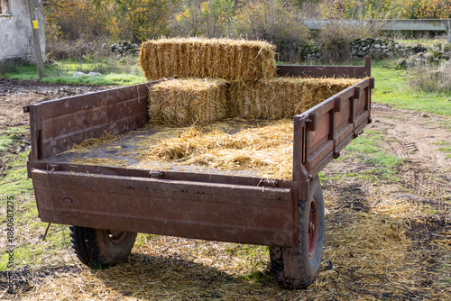 Tractor trailer loaded with hay, close-up.