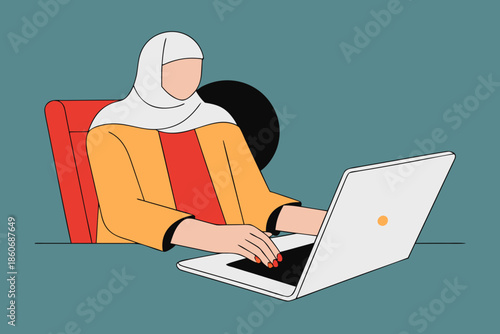 muslim woman in hijab working in an office with a laptop