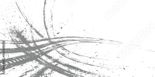 Abstract grunge texture with dynamic grey brush strokes and splatter on a white background