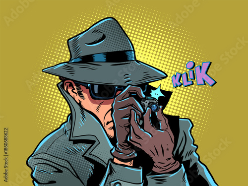 A male detective takes a photo. Surveillance of personal data and photographs. The state is spying on citizens.