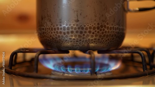 Close Up of a Pot Boiling on a Gas Stove.