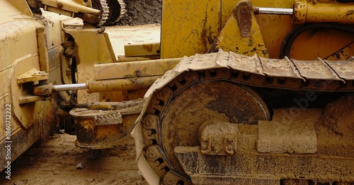 worn bulldozer tracks as background