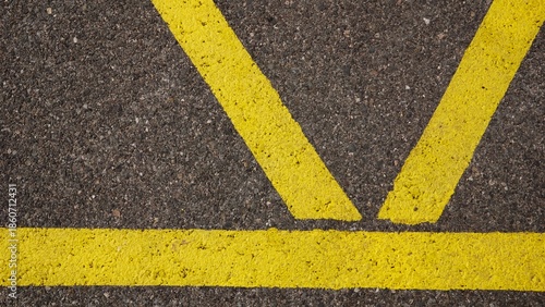 yellow paint marks on asphalt as a background
