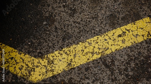 yellow paint line on asphalt