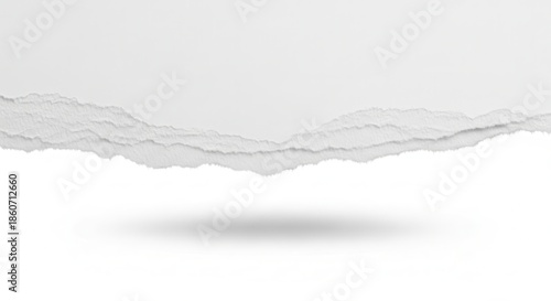 Abstract white torn paper border with a jagged edge and soft shadow, providing a clean, textured background element for design projects, presentations, or conceptual layouts