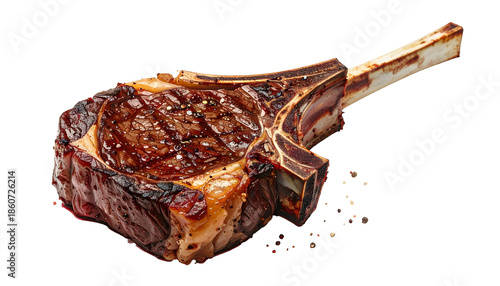 A juicy, seared ribeye steak with a bone-in edge, seasoned with pepper flakes