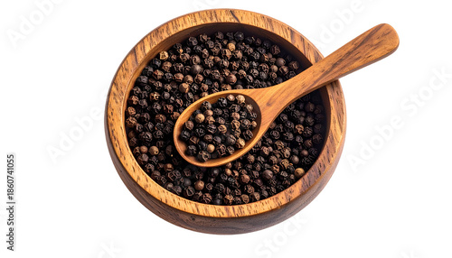 Overhead shot of a wooden bowl filled with black peppercorns and a spoon of peppercorns