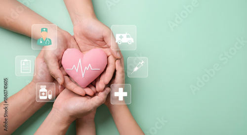 hands holding pink heart with medical symbols