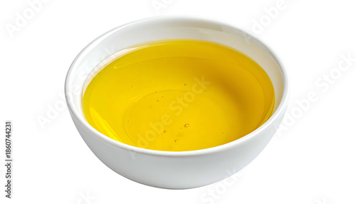Close-up of a white bowl filled with golden liquid, likely oil, isolated on black